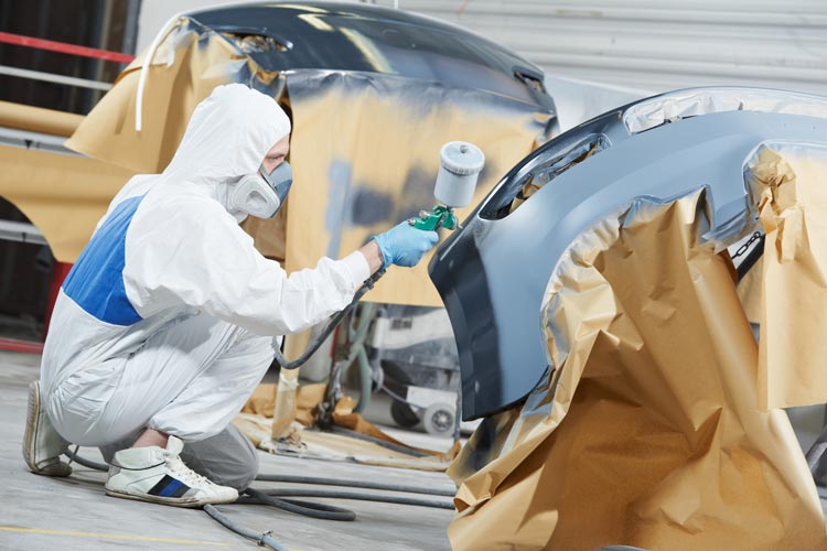 man spraying vehicle